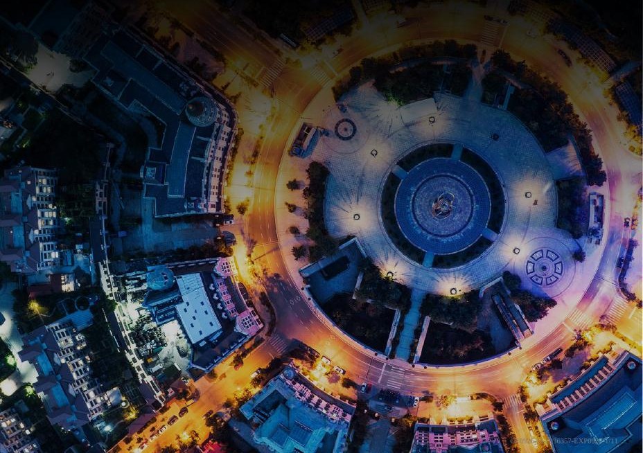 Aerial city photograph from the report cover